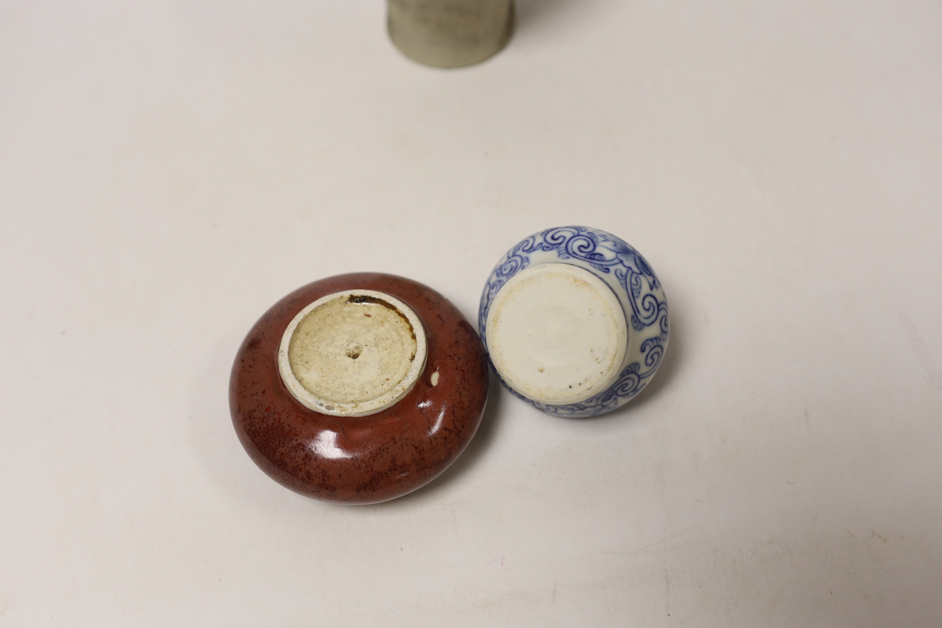 A Chinese sang de boeuf brush washer, a miniature blue and white vase and another vase, largest 14cm high